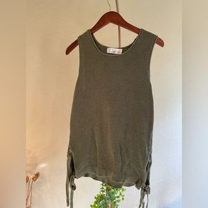 Green knit sleeveless shirt. Size small. Like new.